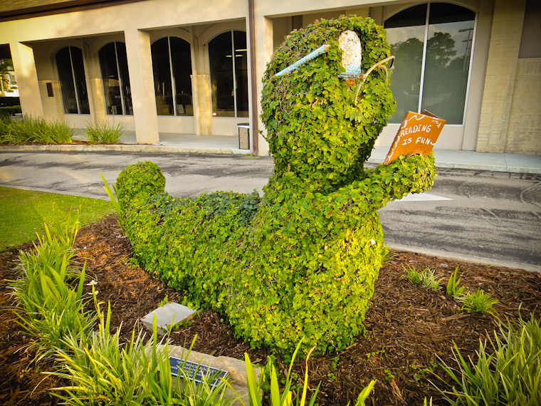 Carved shrub sculpture at library