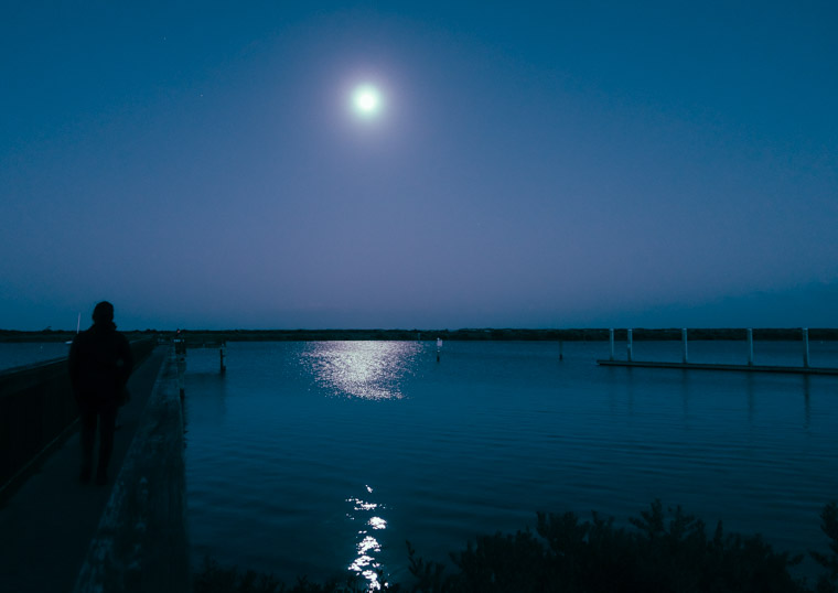 Moonrise over intracoastal dock and boat ramp